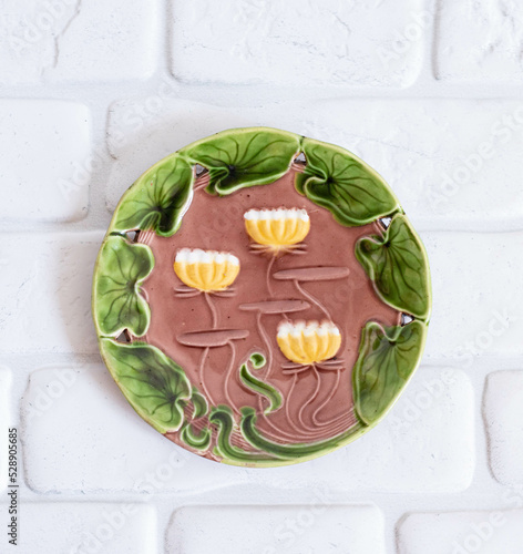 Tableau sur toile Antique porcelain plate with lotus flowers, art nouveau style