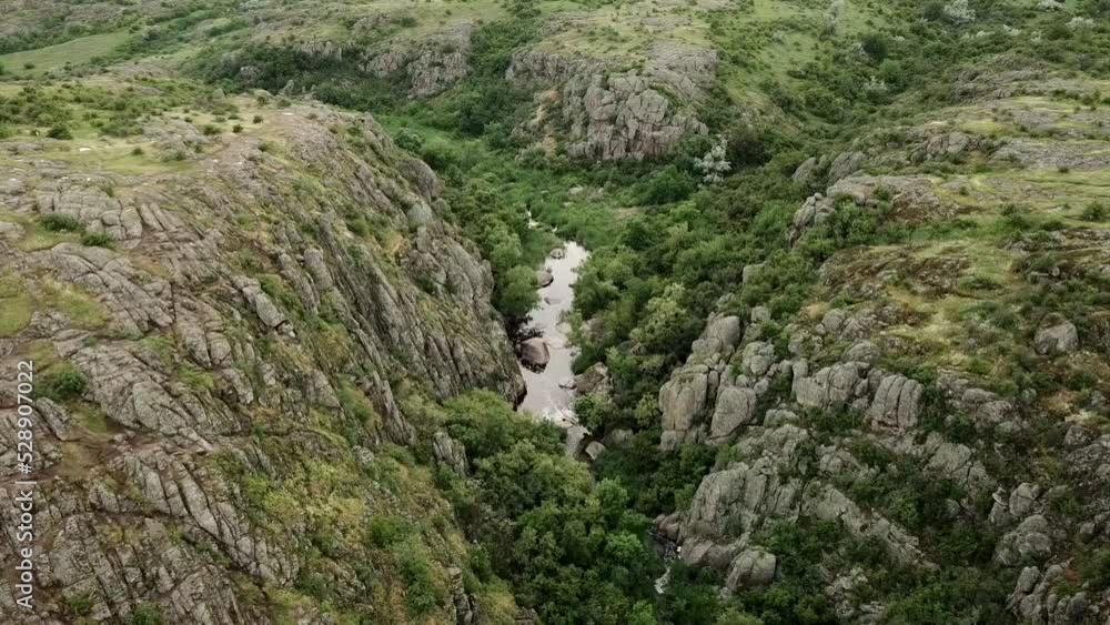 Flying over the small river in hilly area. Aerial video Flying over the small river in hilly area. Aerial video