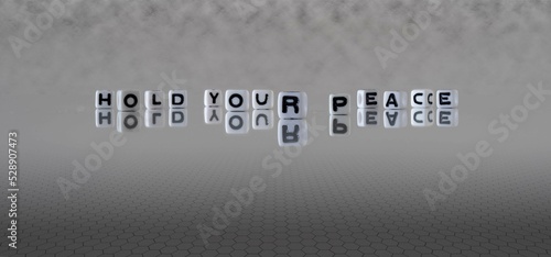 hold your peace word or concept represented by black and white letter cubes on a grey horizon background stretching to infinity