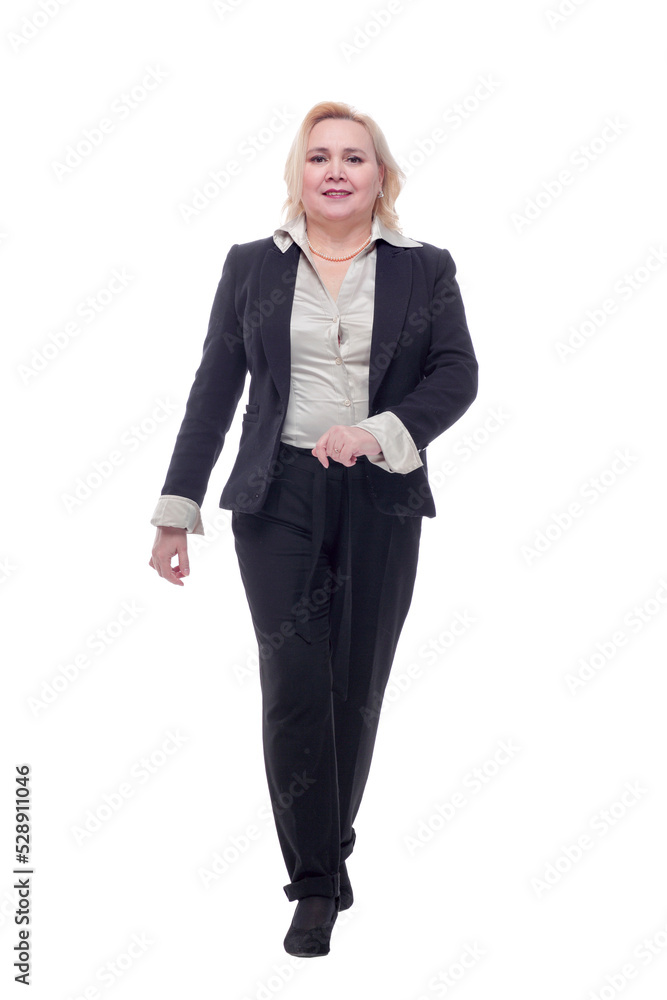 Happy business woman walking towards camera and smiling Happy business woman walking towards camera and smiling