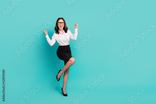 Full size photo of delighted executive lady fist up achieve partnership agreement isolated on cyan color background