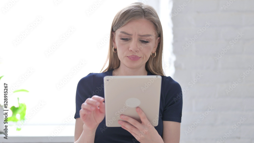 Portrait of Woman having Loss on Tablet in Office Portrait of Woman having Loss on Tablet in Office