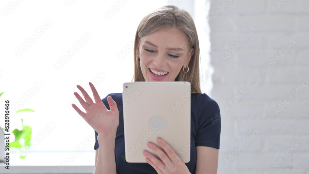 Portrait of Video Call on Tablet by Woman in Office Portrait of Video Call on Tablet by Woman in Office