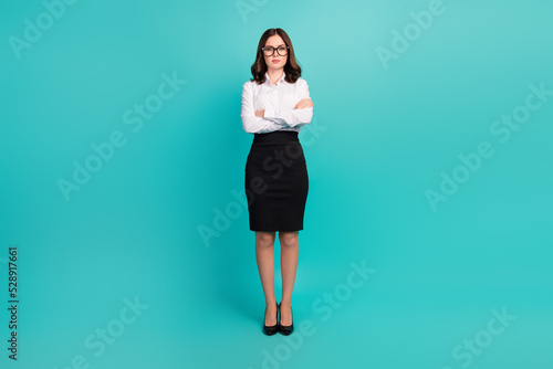 Full length photo of successful gorgeous person crossed arms isolated on teal color background