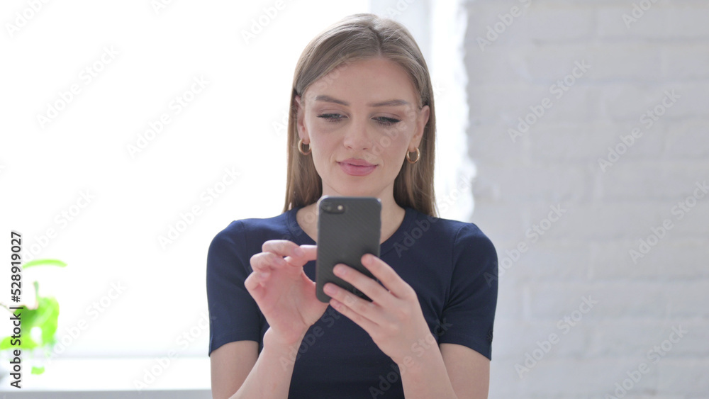 Fototapeta premium Portrait of Woman using Smartphone, Internet