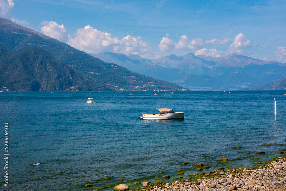 A boat on lake Como, Italy in summer, famous tourism destination A boat on lake Como, Italy in summer, famous tourism destination
