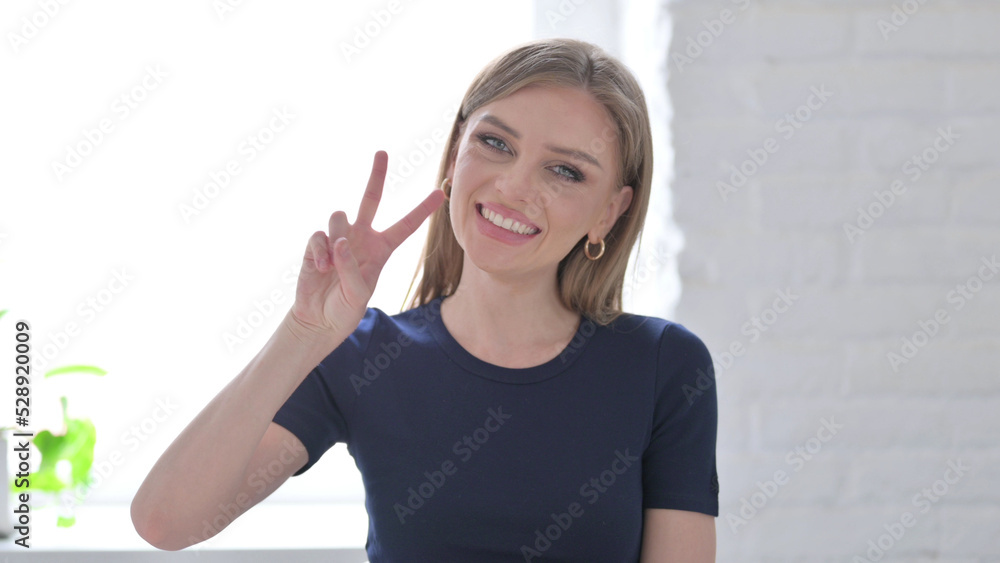 Portrait of Woman showing Victory Sign with Finger Portrait of Woman showing Victory Sign with Finger