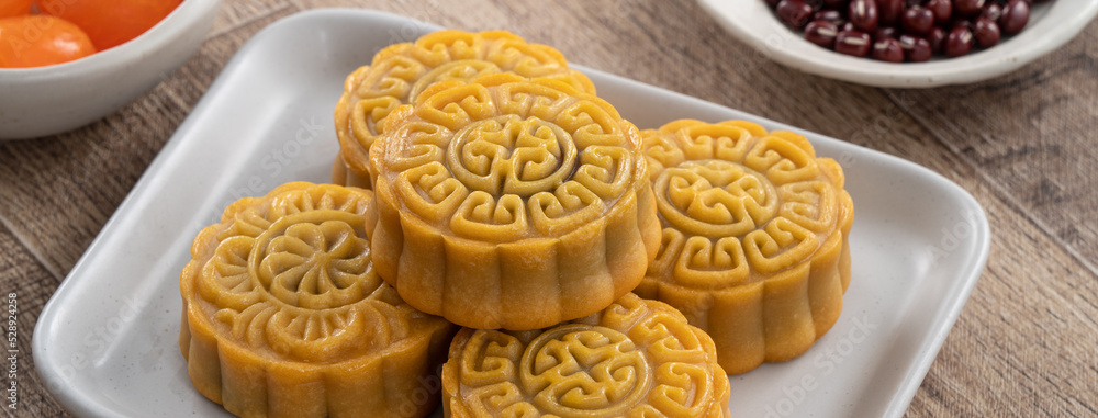 Delicious Cantonese moon cake for Mid-Autumn Festival food mooncake on wooden table background. Delicious Cantonese moon cake for Mid-Autumn Festival food mooncake on wooden table background.