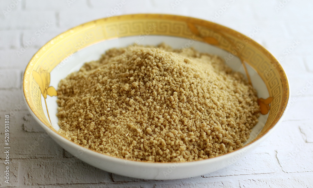 Instant tiwul on a plate. Ready to cook. Tiwul is a traditional Indonesian food that used to be a staple substitute for rice. Instant tiwul on a plate. Ready to cook. Tiwul is a traditional Indonesian food that used to be a staple substitute for rice.