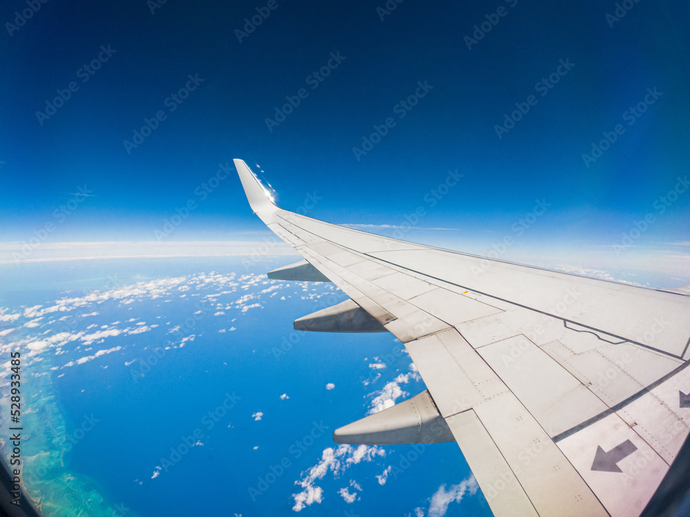 Fototapeta premium View from an Airplane during flight with clouds