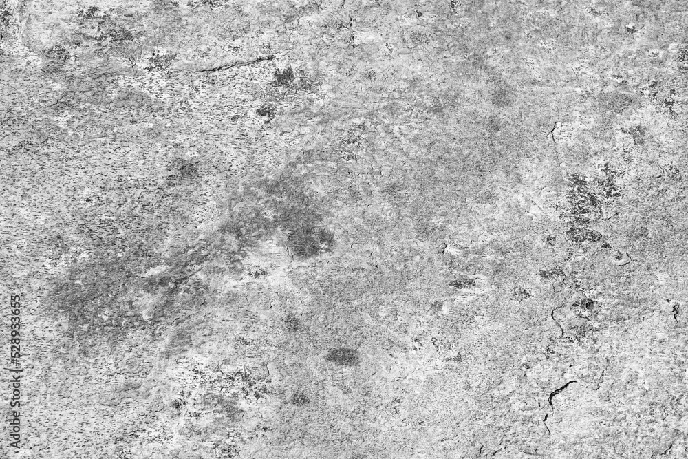Obraz premium Rough stone texture of gray color. Stone facade detail of a house. Hard and rough material