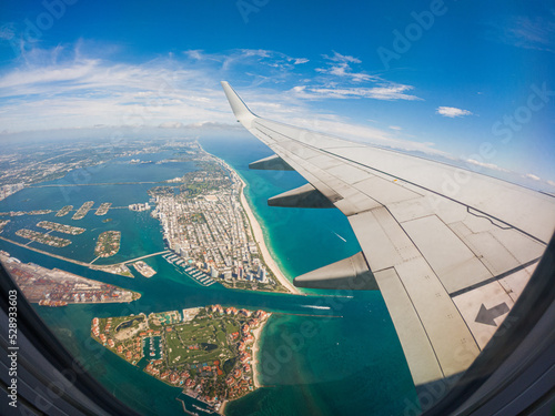 Airplane after takeoff at MIA overflying Miami Beach, Florida