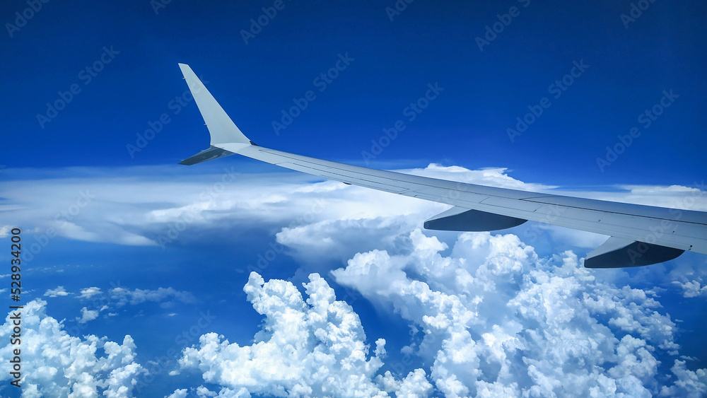 View from an Airplane during flight with clouds View from an Airplane during flight with clouds