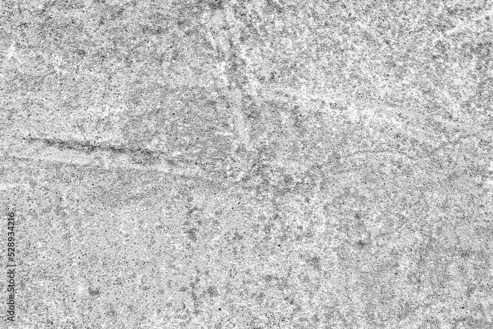 Obraz premium Rough stone texture of gray color. Stone facade detail of a house. Hard and rough material