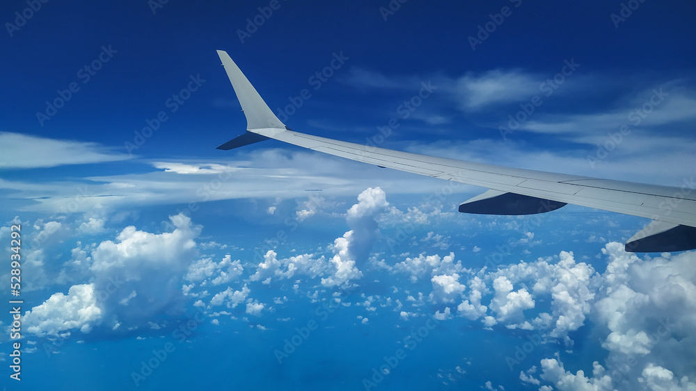 View from an Airplane during flight with clouds View from an Airplane during flight with clouds