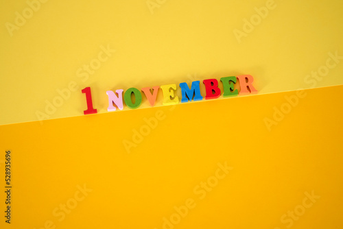 November 1st. Image of november 1 calendar on yellow background. Empty space for text photo