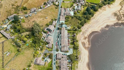 Aerial drone footage of a typical rural English Yorkshire Village with mills. Shot at Leeming above Oxenhope and adjacent to Leeming Reservoir near Haworth in the heart of Yorkshire's Bronte Country . photo