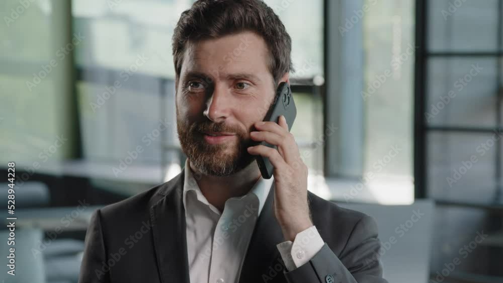 Emotional adult bearded professional businessman client Caucasian man making business call talking on phone in office close up salesman enjoying mobile conversation indoors distant talk negotiation Emotional adult bearded professional businessman client Caucasian man making business call talking on phone in office close up salesman enjoying mobile conversation indoors distant talk negotiation