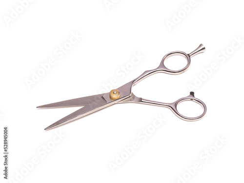 Old professional barber scissors metallic color. Isolated on white background