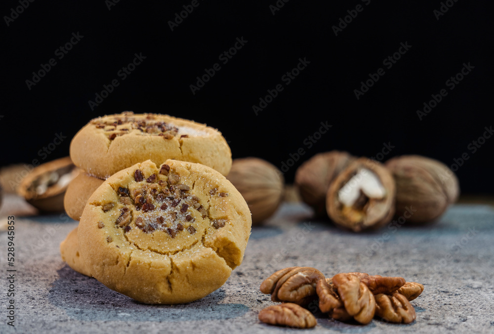 walnut cookies on a black background side view