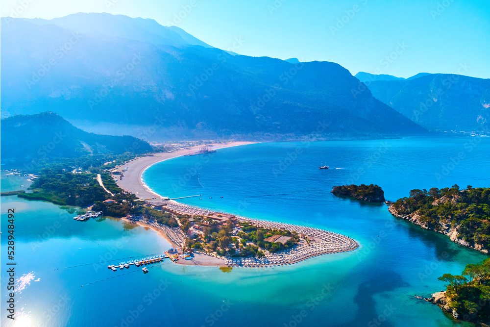 Obraz premium Aerial view of sea bay with sandy beach at sunny day in summer. Drone photo of Blue lagoon in Oludeniz, Turkey