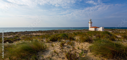 Polente Lighthouse is located at the westernmost edge of Bozcaada and was built in 1861. Polente light is 32 meters high and can send its light up to 15 nautical miles or 28 kilometers. photo