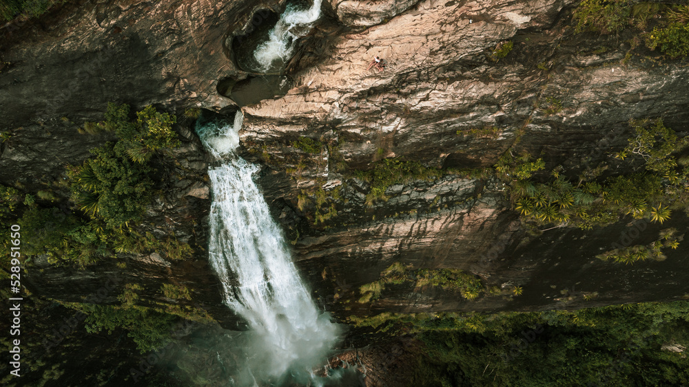 Natural Landscape with a huge waterfall from the mountains, green hills and jungle, Diyaluma in Sri Lanka.