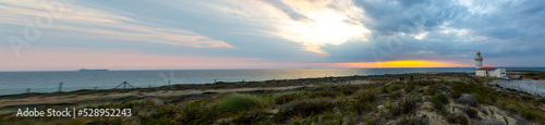 Polente Lighthouse is located at the westernmost edge of Bozcaada and was built in 1861. Polente light is 32 meters high and can send its light up to 15 nautical miles or 28 kilometers. photo