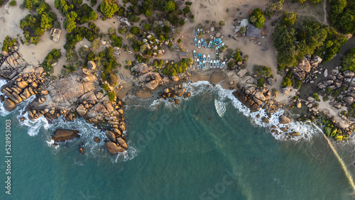 Obraz na płótnie Ocean tropical landscape, rocky coast with fishing boats, drone shot, water and beach. w salonie