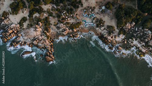 Obraz na płótnie Ocean tropical landscape, rocky coast with fishing boats, drone shot, water and beach. w salonie
