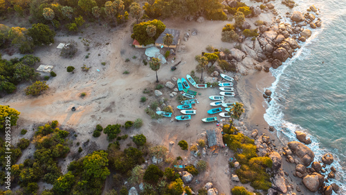 Obraz na płótnie Ocean tropical landscape, rocky coast with fishing boats, drone shot, water and beach. w salonie