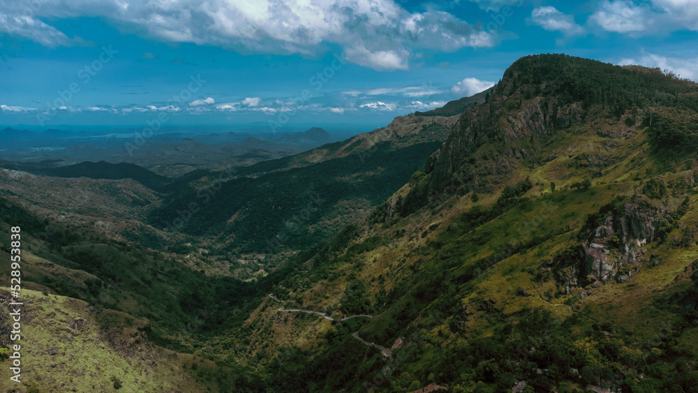 Beautiful mountain landscape with green mountains and blue sky.