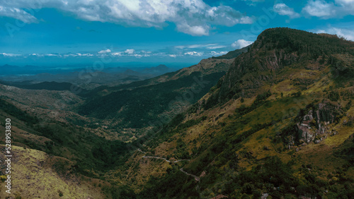 Beautiful mountain landscape with green mountains and blue sky.