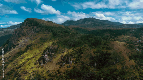 Obraz na płótnie Beautiful mountain landscape with green mountains and blue sky. w salonie