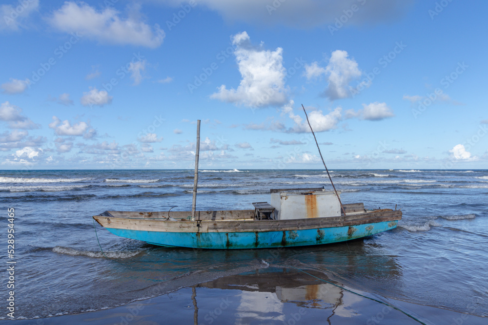 Fototapeta premium boat on the beach in the city of Ilheus, State of Bahia, Brazil