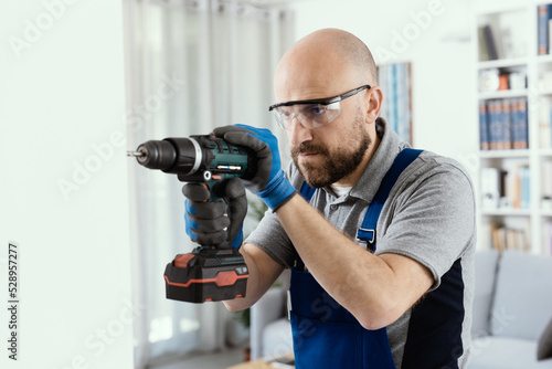 Professional handyman using a drill