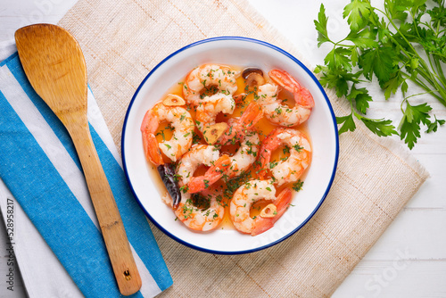 Gambas al ajillo. Shrimp Scampi. Traditional tapa recipe from the south of Spain cooked with seafood and sautéed garlic.