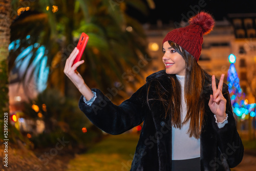 Christmas in the city  winter  decoration. Enjoying the night taking a selfie