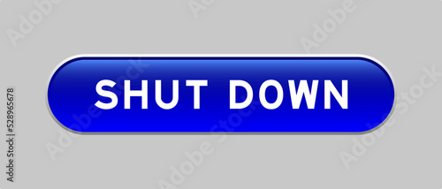 Blue color capsule shape button with word shut down on gray background