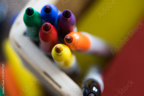 Colorful Sharpie pen tips close up in a basket photo