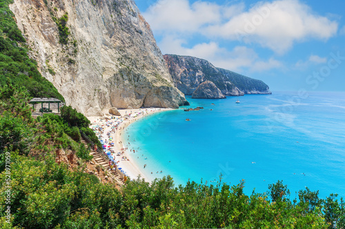 The magnificent Porto Katsiki beach on Lefkada Island, Greece. Beautiful landscape with sea coast, swimming people, trees, azure water.