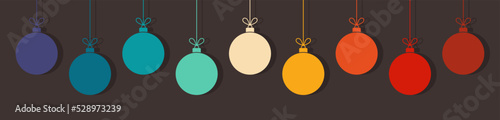 Christmas balls ornaments in retro colors on dark background.