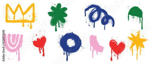 Set of graffiti spray pattern. Collection of colorful symbols, heart, crown, flower, dot and stroke with spray texture. Elements on white background for banner, decoration, street art and ads.