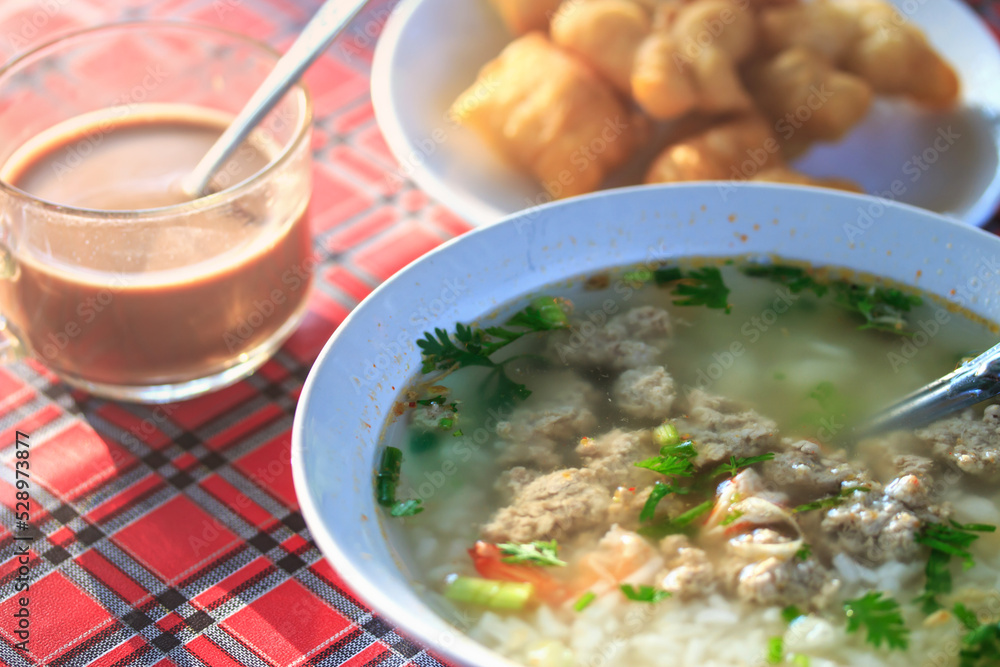 Boiled rice pork and shrimp or mush morning with coffee and deep-fried dough stick Boiled rice pork and shrimp or mush morning with coffee and deep-fried dough stick