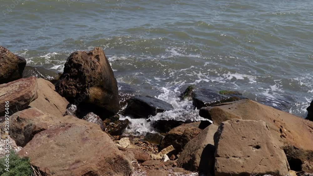 Sea Coast With Rocky Beach In Windy Weather With Waves, Splashes And Foam. Strong Wave On The Beach. 60 FPS, 4k, ProRes Sea Coast With Rocky Beach In Windy Weather With Waves, Splashes And Foam. Strong Wave On The Beach. 60 FPS, 4k, ProRes