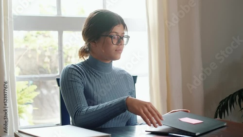 Tired bored teenage girl school student feeling headache or fatigue doing homework at home. Exhausted depressed sick teenager studying alone worried about difficult education problems concept.
 photo