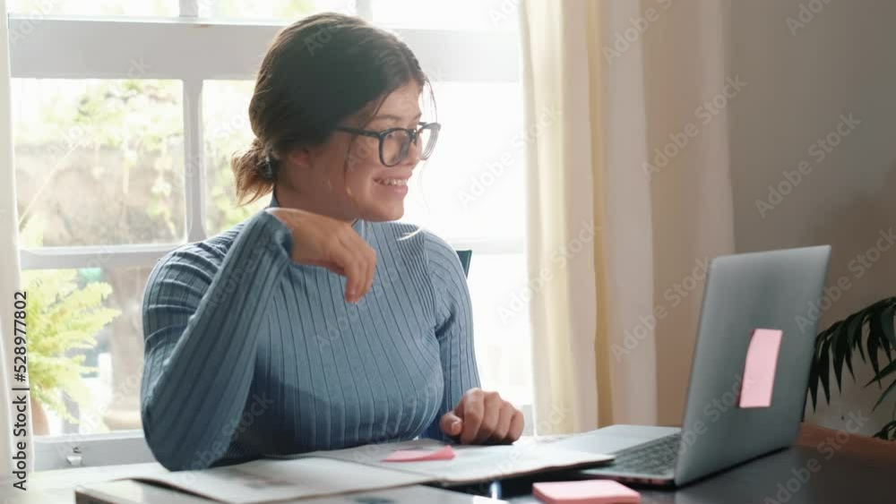 One young pretty woman studying and doing homework at home on the table. Female teenager using laptop or computer surfing the net indoor.
One young pretty woman studying and doing homework at home on the table. Female teenager using laptop or computer surfing the net indoor.