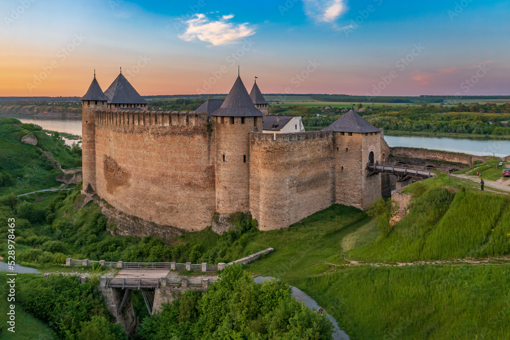 Sunset view of Khotyn Fortress, where the Dniester River is visible in the background