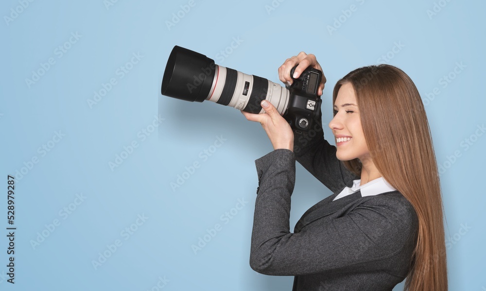 smiling Woman photographer is taking images photo with camera smiling Woman photographer is taking images photo with camera