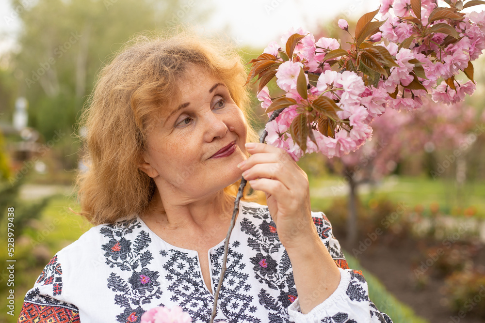 senior smiling ukrainian woman in park, happy retirement senior smiling ukrainian woman in park, happy retirement